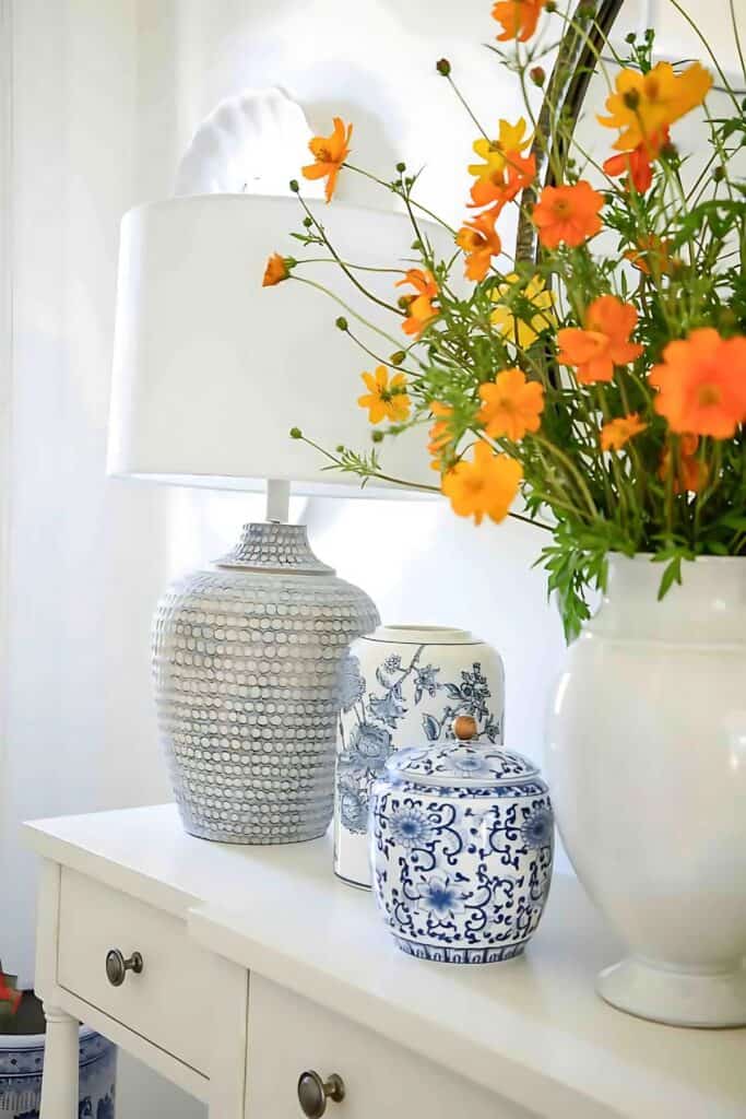 foyer- vase of orange cosmos