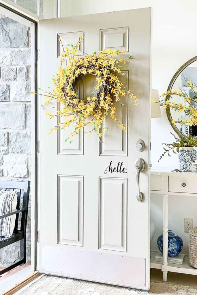 foyer- forsythia wreath on the door