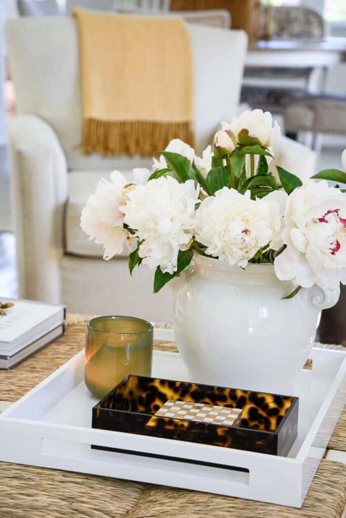 coffee table with a tray and peonies 
