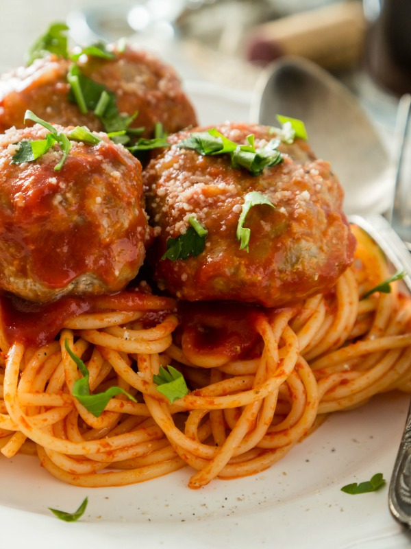 trio of meatballs on a mound of spaghette