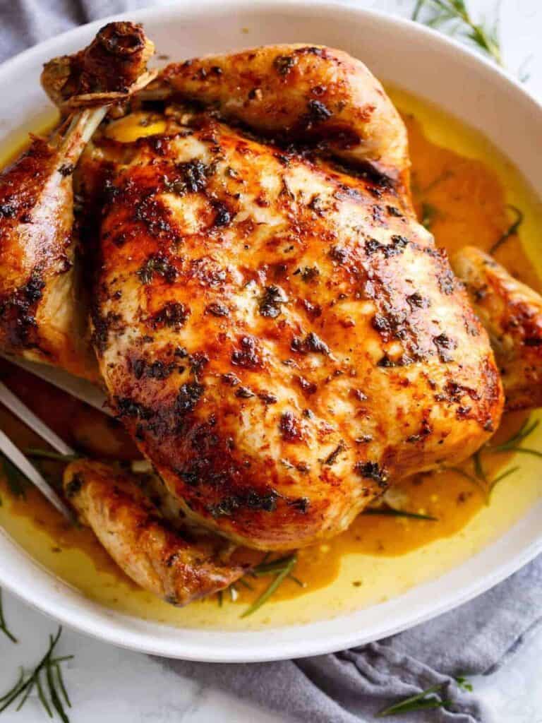 roasted chicken in a ceramic baking dish