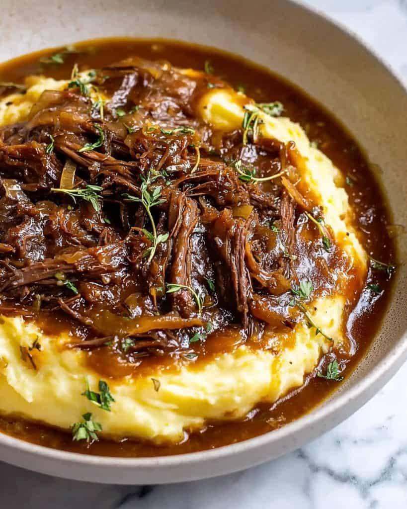 pot roast on a bed of potatoes