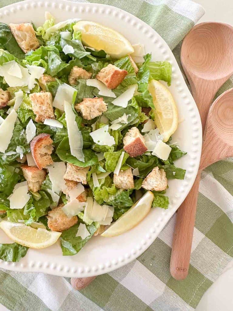 caesar salad in a white bowl