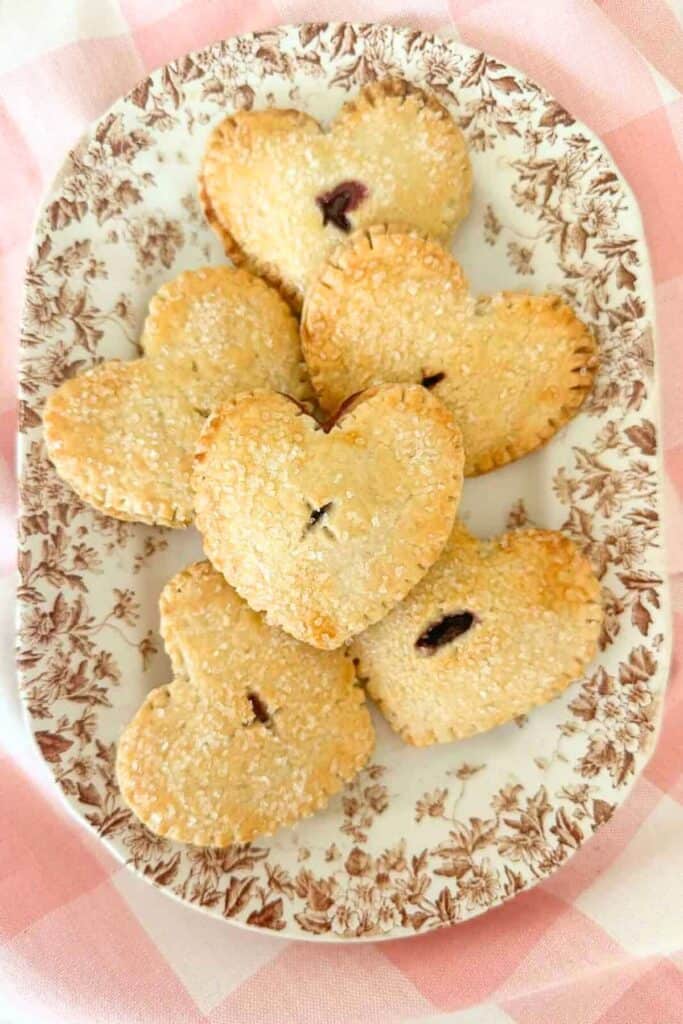 heart in hand pies on a brown transferware plate