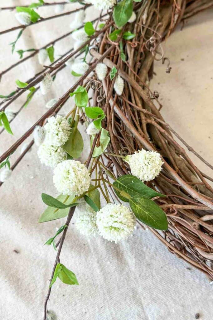close up of  globe shaped flowers on the wreath