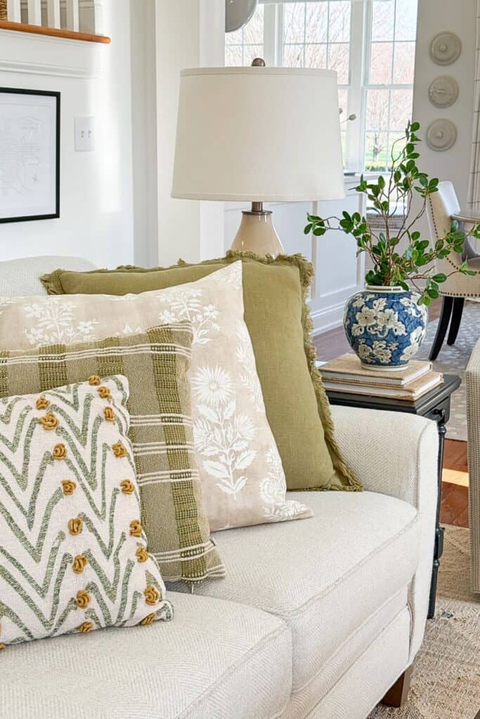 budget-decorating-ideas-pillows-lamp-greenery.jpg