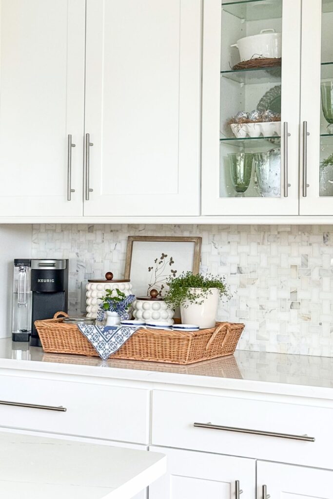 spring kitchen decorating ideas with coffee station styled with basket, canisters, and greenery