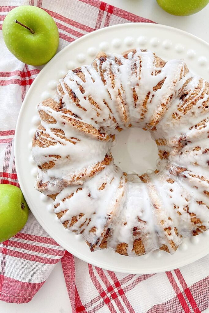 raw apple cake on a white plate
