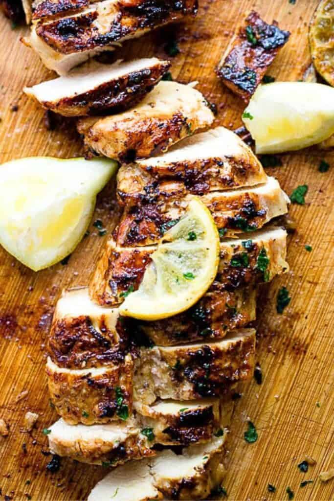 lemon grilled chicken on a wooden plank