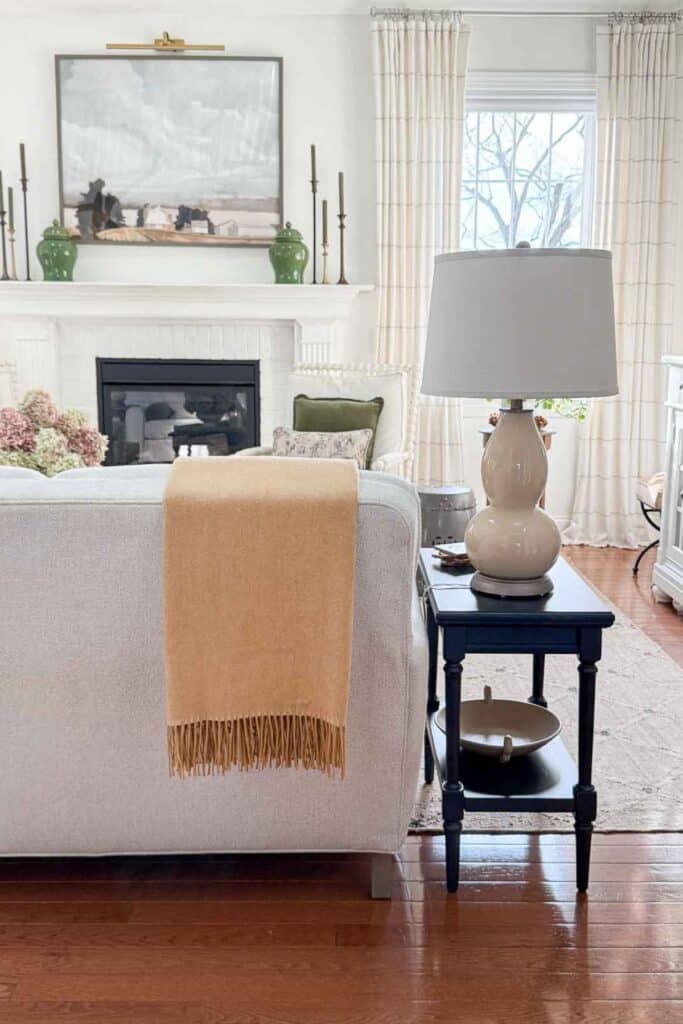 How to style a decorative throw folded over the back of a sofa