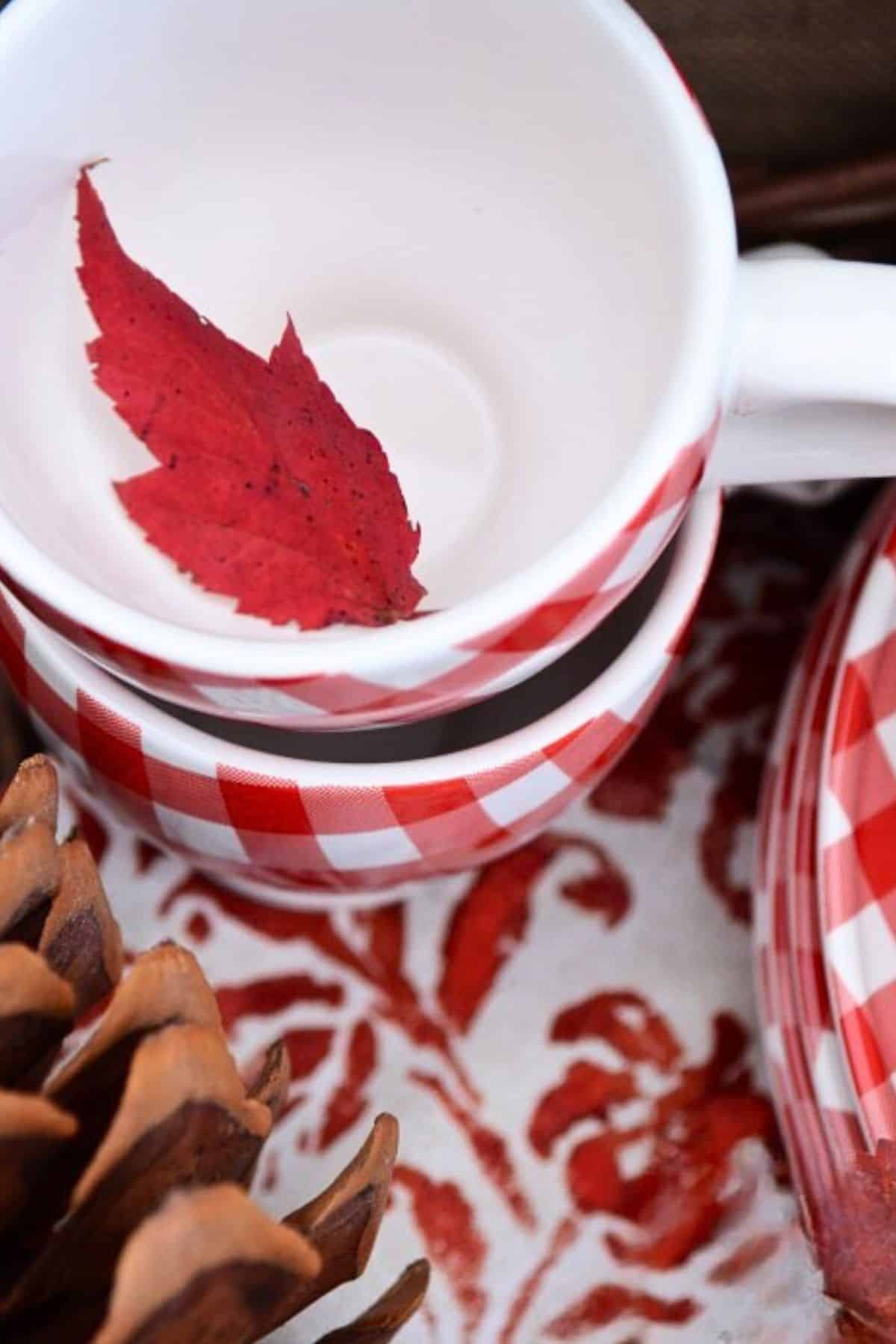 cups with a leaf in it