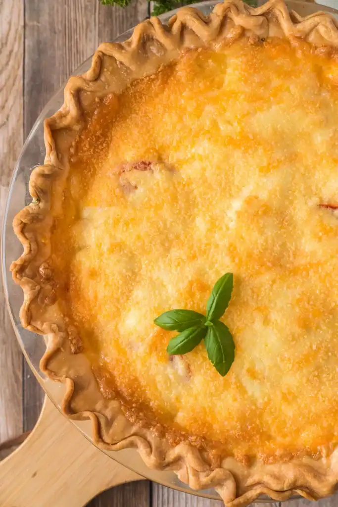 tomato pie with a basil sprig