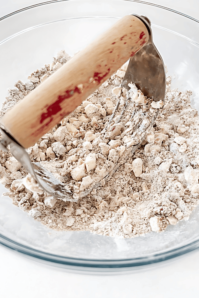 PUMPKIN SPICE COFFEE CAKE STREUSEL BEING MADE IN A DEEP BOWL