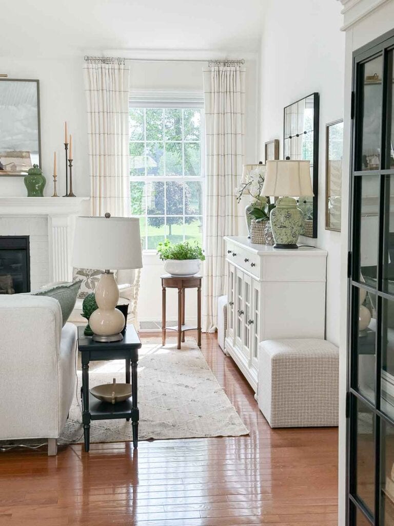 white buffet- focal point in the living room and fireplace