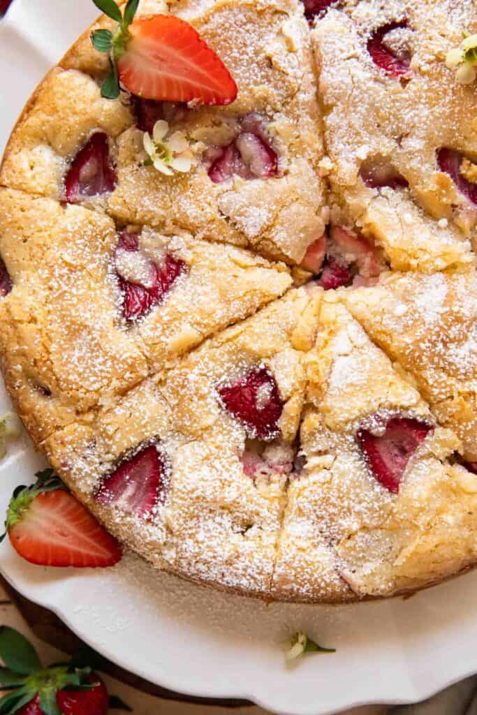 French strawberry cake on a fluted white plate
