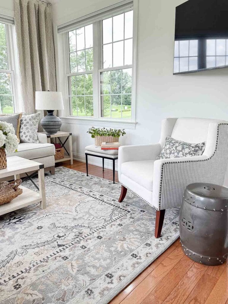 tv on the wall above a chair