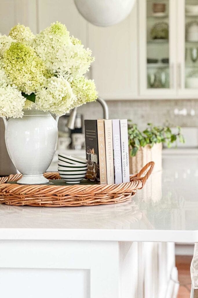 HYDRANGEAS IN A WHITE VASE IN A  THE KITCHEN