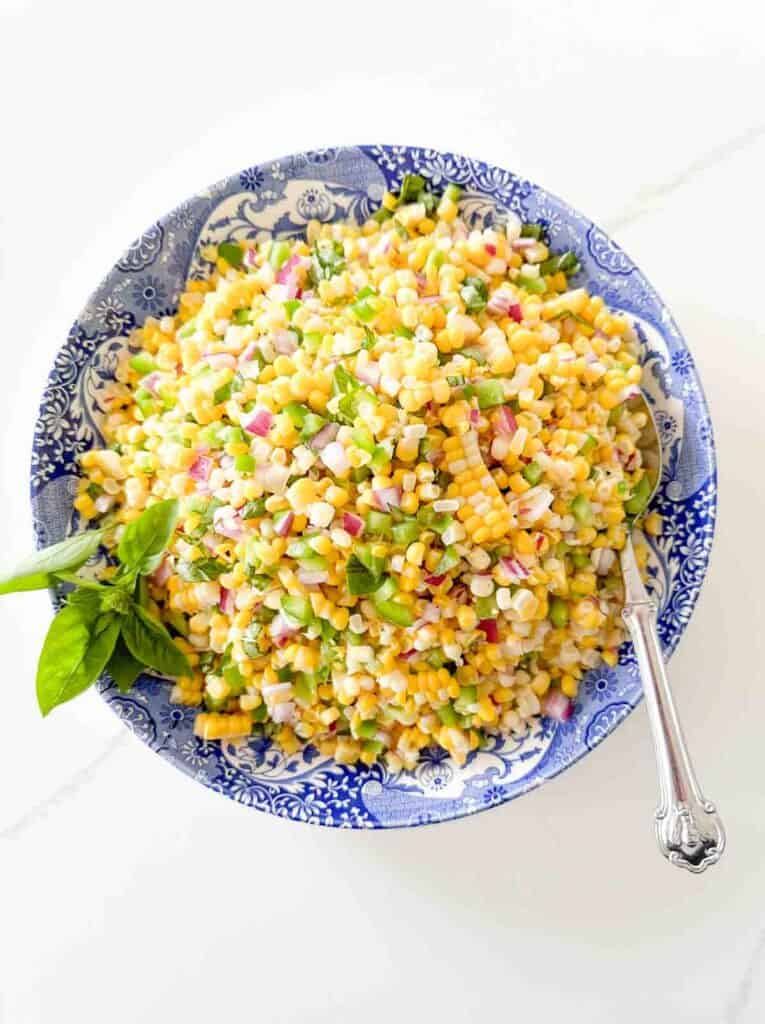 corn salad in a blue and white bowl