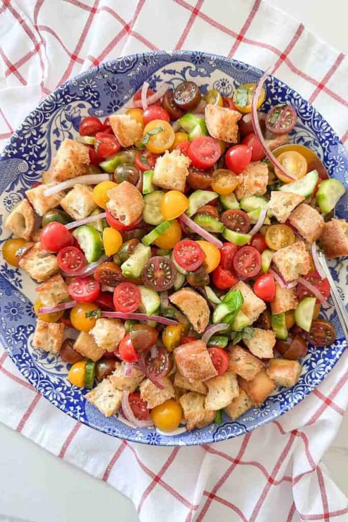 panzanella salad in a large blue and white bowl
