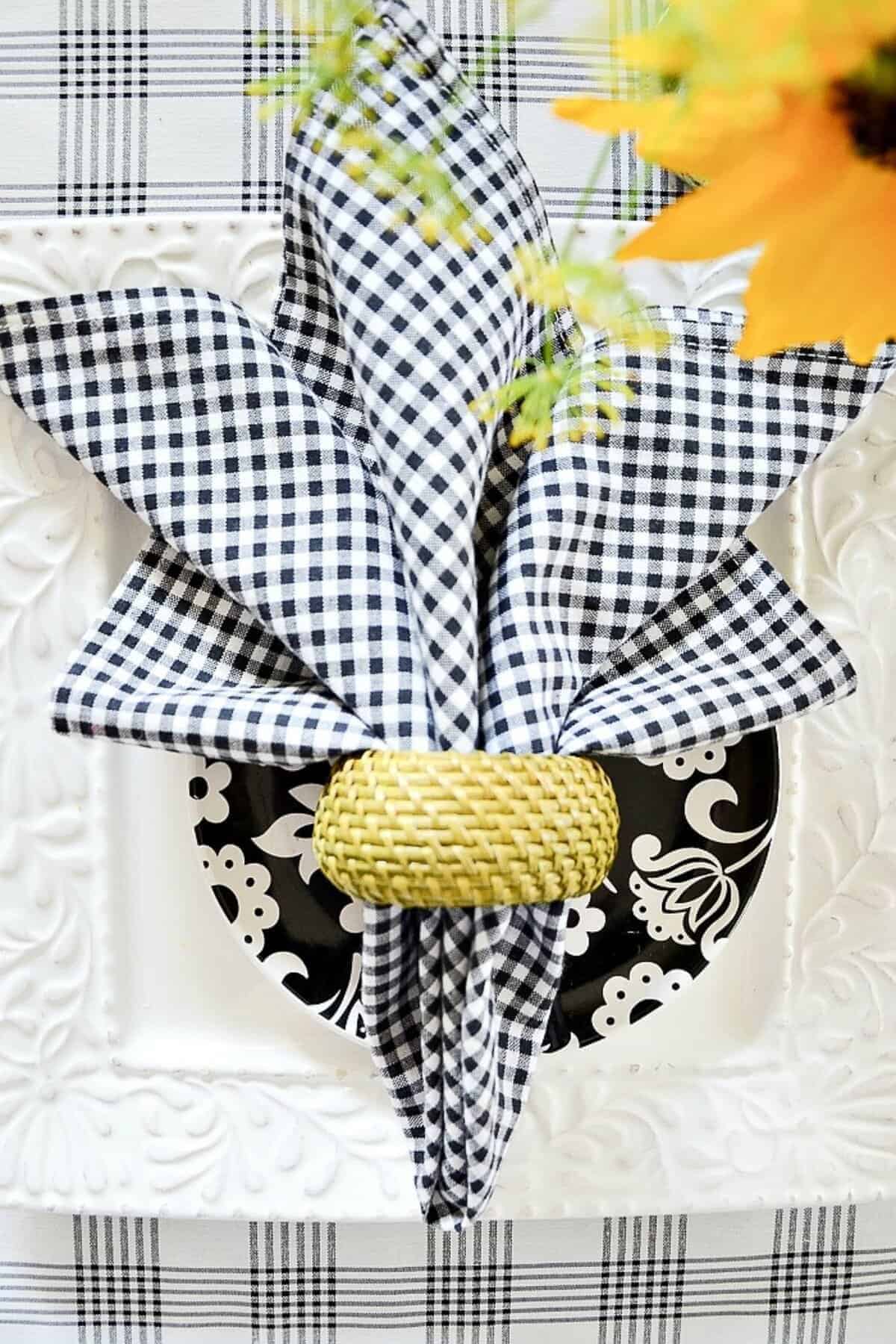 black and white place setting with sunflower