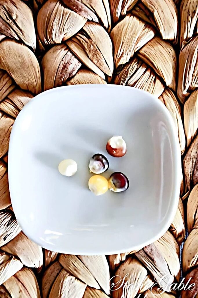 5 Kernels Of Corn in a white dish