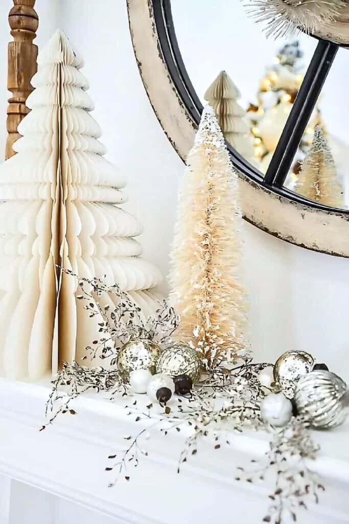 Christmas trees on a mantel ledge