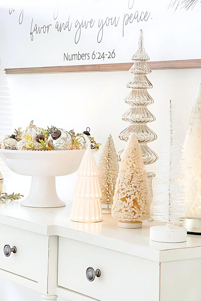 Christmas trees on a white console table-2