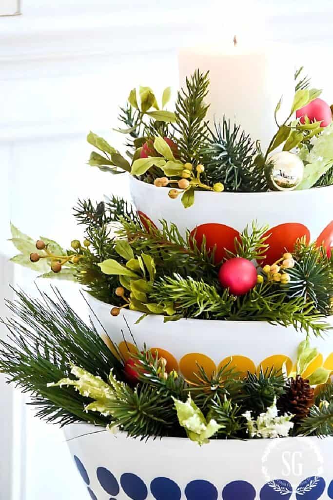 STACKING BOWLS WITH SPRIGS OF GREENS
