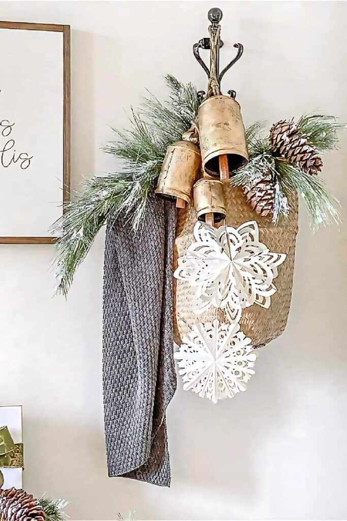faux Christmas greens in a basket on a vertical hook