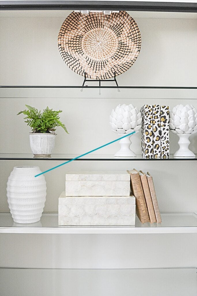 bookshelf styling showing balance with decor arranged evenly