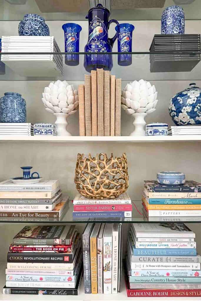 curio cabinet styled in the popular more is more look