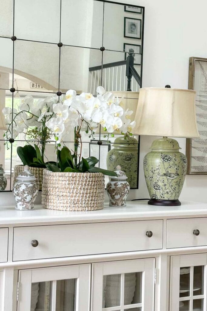 1- STORIED HOME: ORCHIDS ON A WIHITE BUFFET