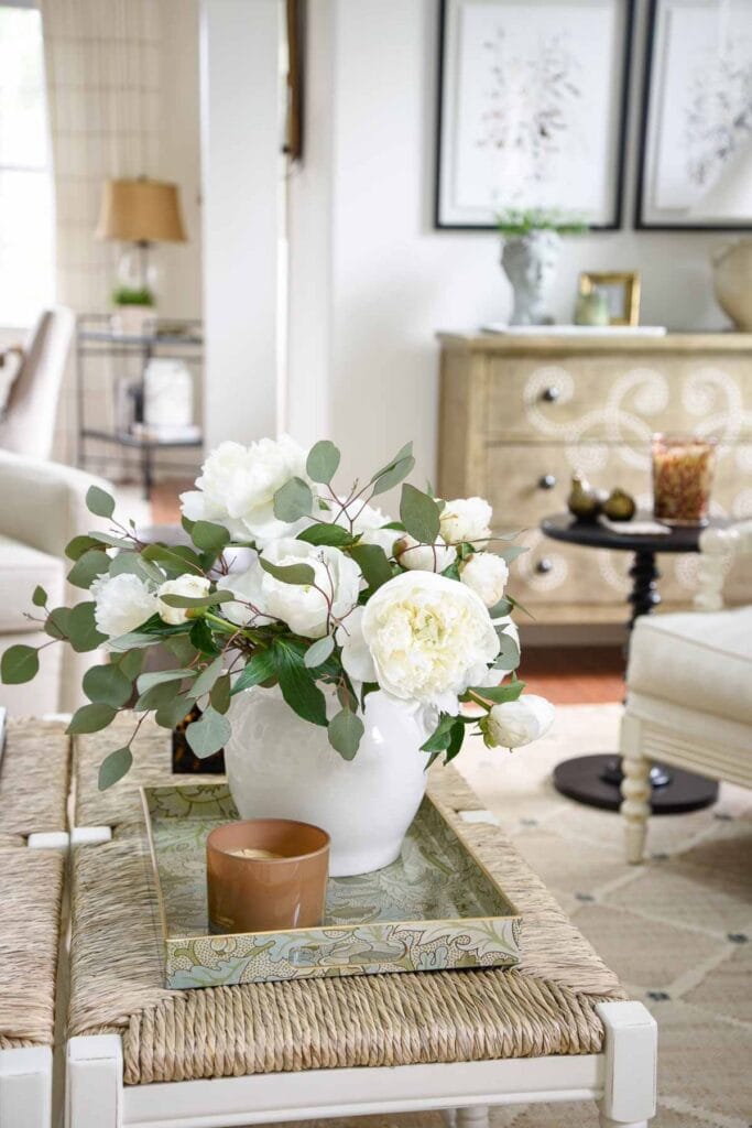 1- STORIED HOME: PEONIES IN A TRAY ON A THRUSH TOPPED COFFEE TABLE