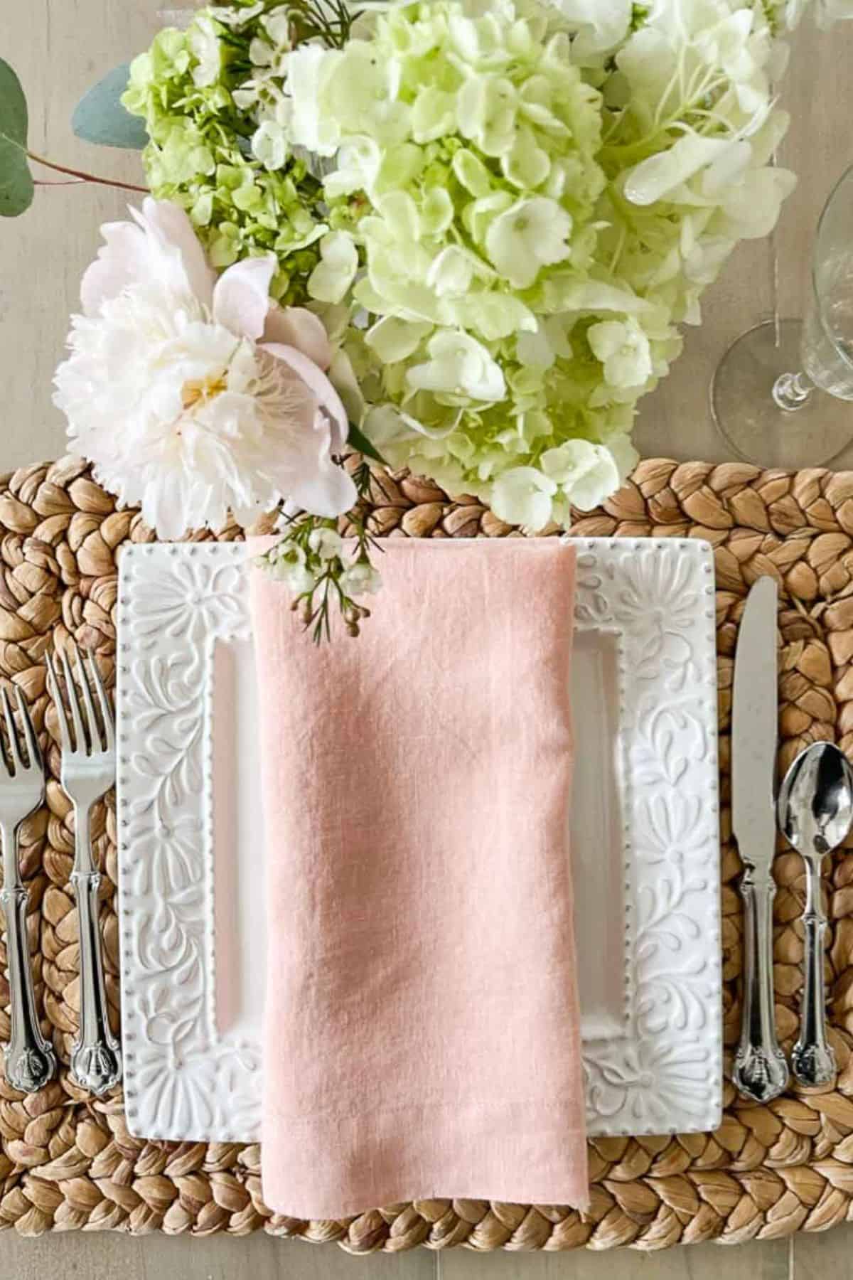 1- STORIED HOME: ballet pink napkin on top of a white plate
