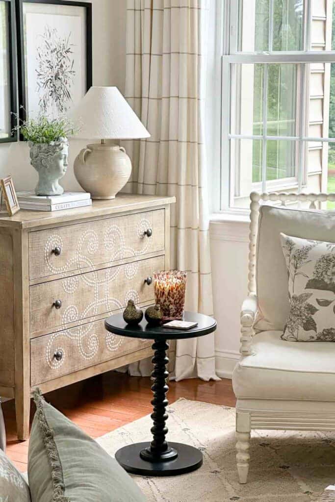 curlacue chest in the corner of a living room