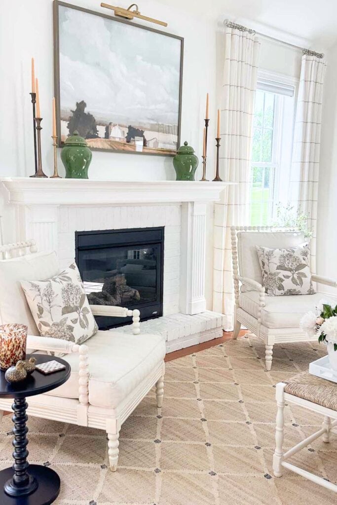 Layering Decor-living room with fireplace flanked by chairs