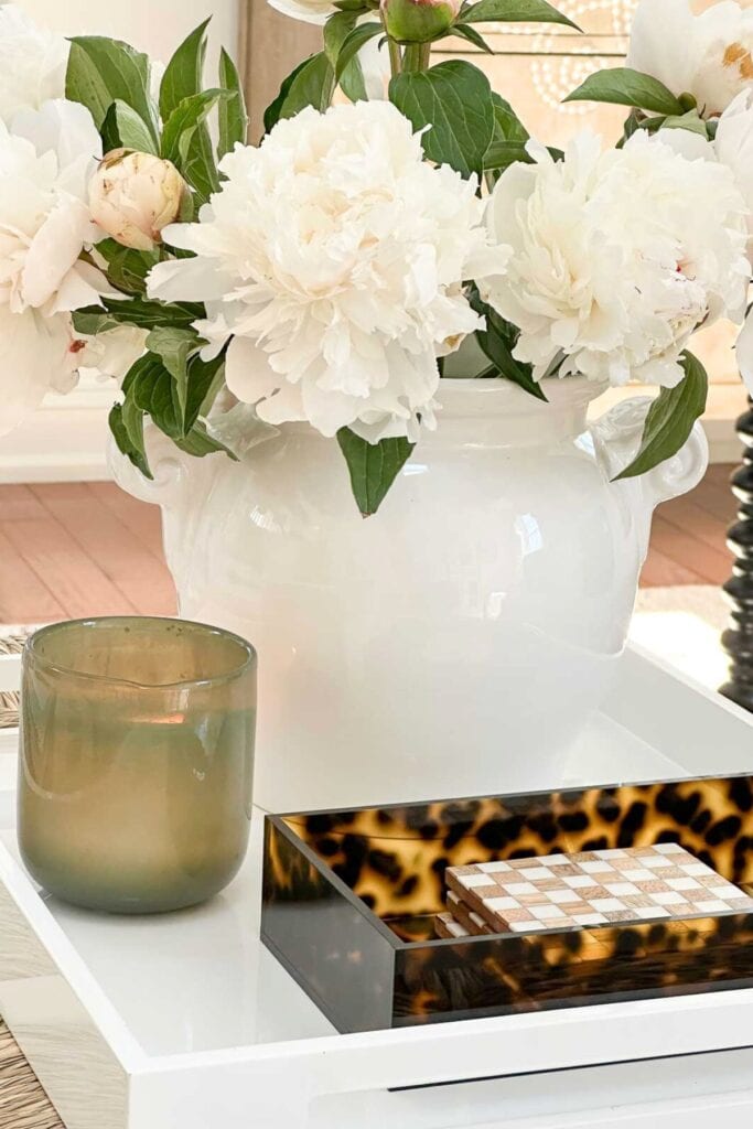 Layering Decor-vignette of accrent decor inside a white tray