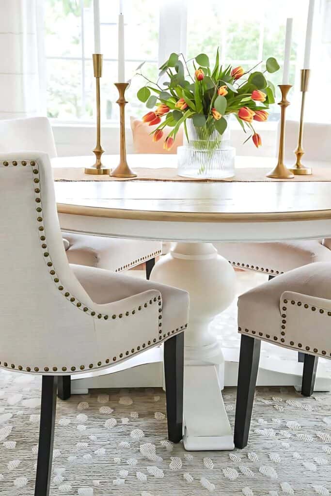 classic round table with nailhead chairs