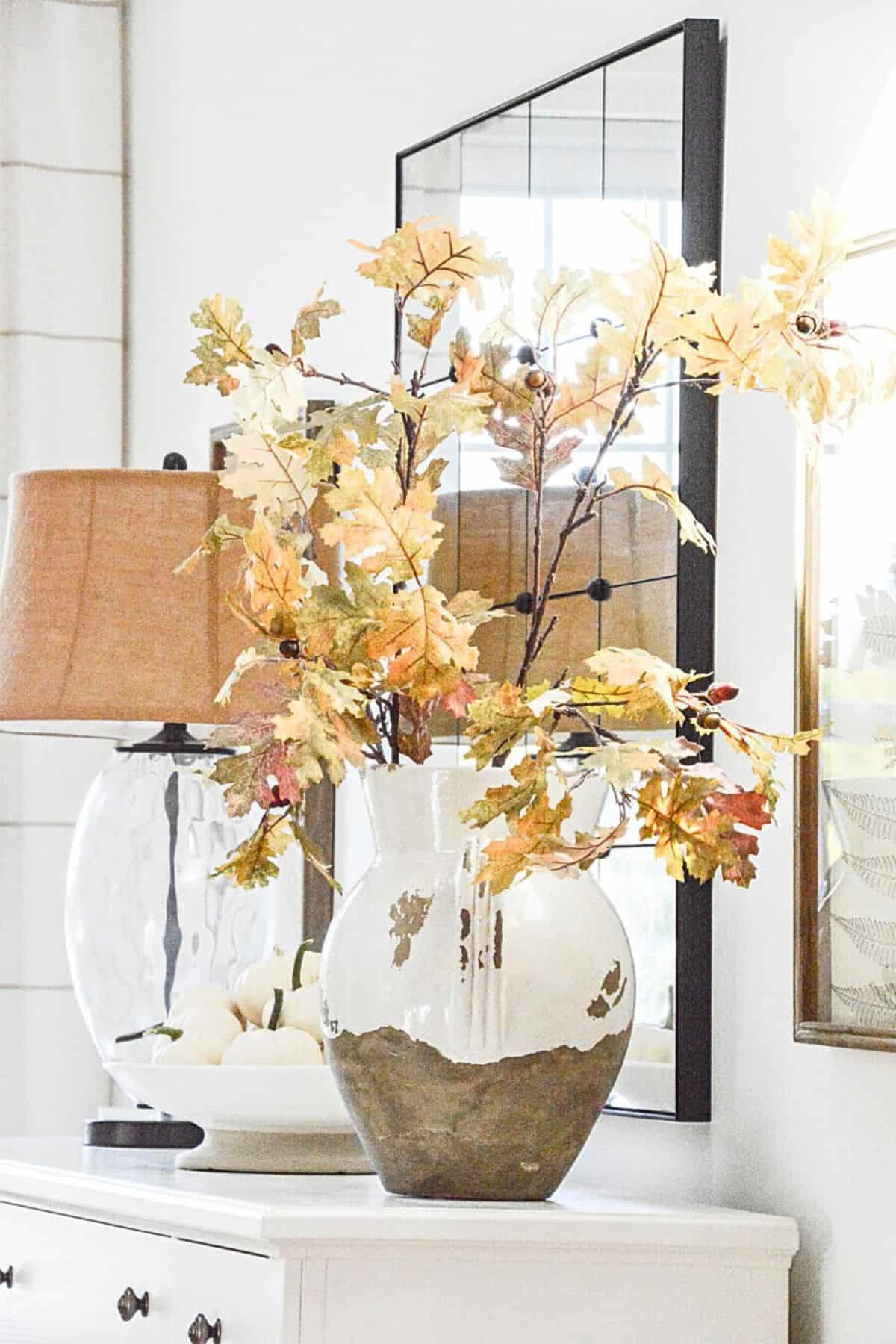 fall oak branches in a large urn