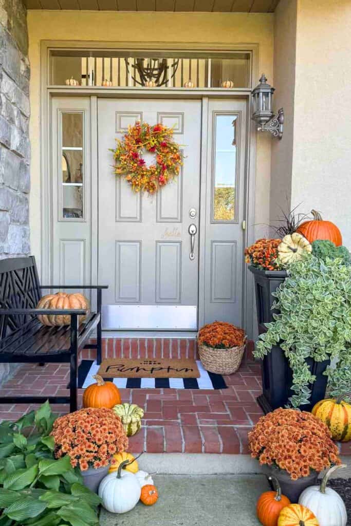 fall front porch abundant with seasonal colors and elements
