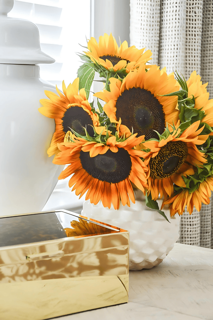sunflower arrangement in a white vase