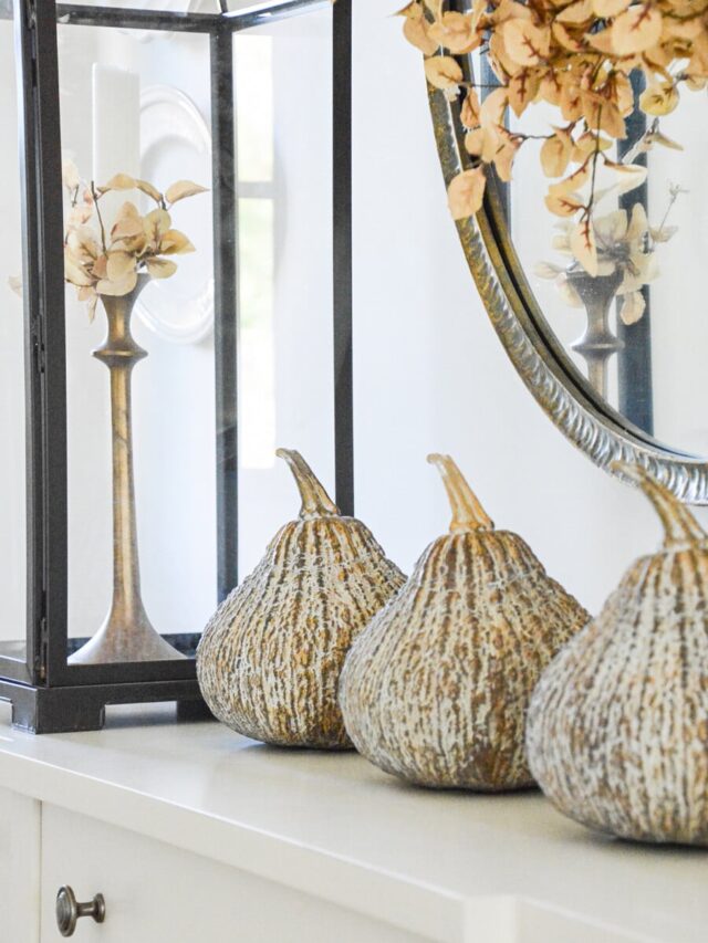 gourds on the console in the living room