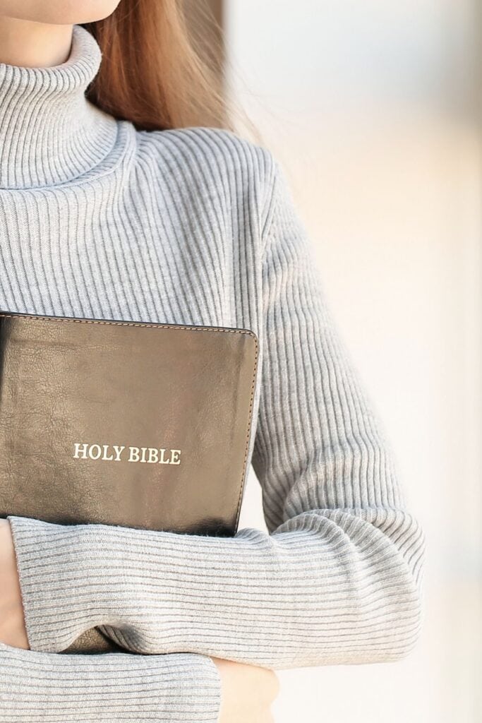 woman holding a Bible