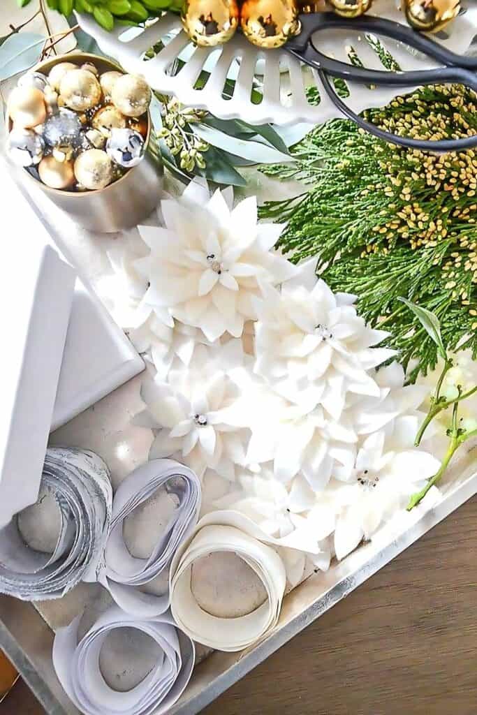 tray with items to embellish a Christmas gift