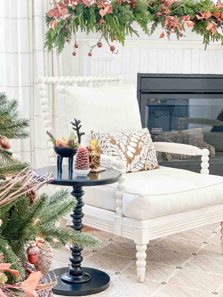 white chair in a living room decorated for Christmas