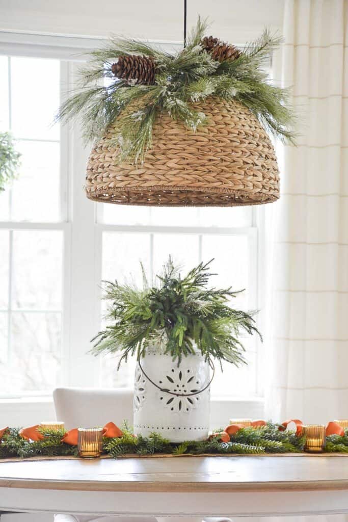 A large Christmas arrangement on a dining room table