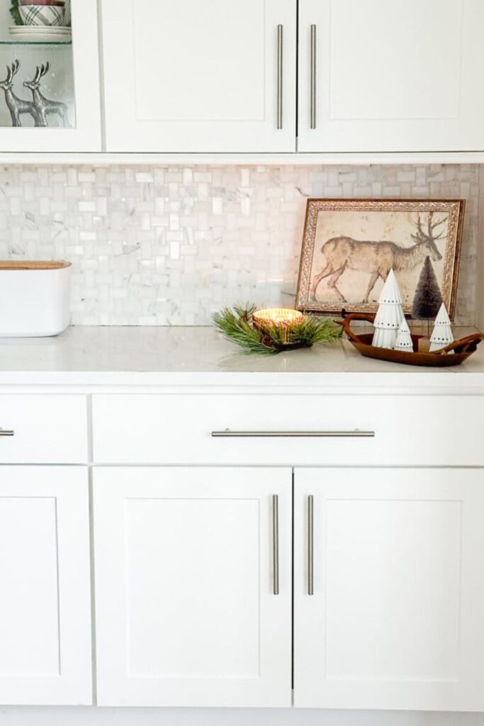 1 Christmas Kitchen-picture of a reindeer propped on a kitchen counter