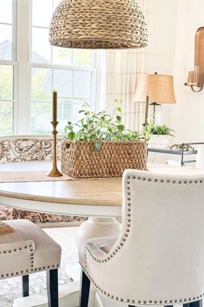 dining room table with a plant in a basket