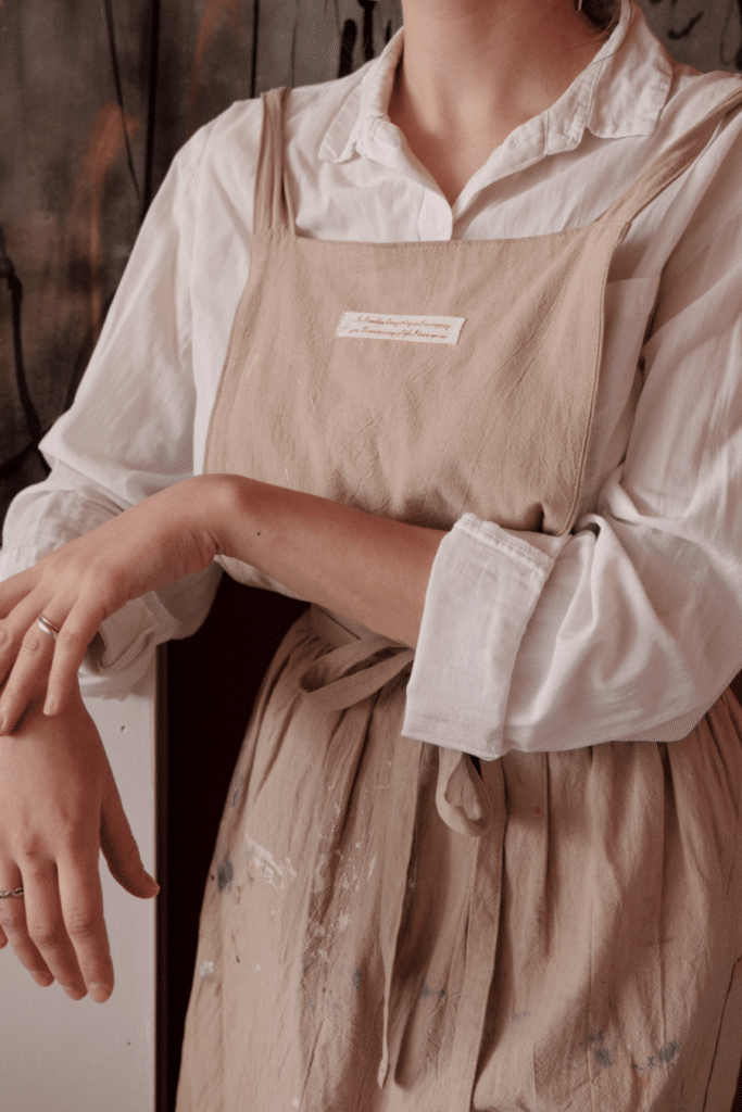 canva- lady with a linen apron on