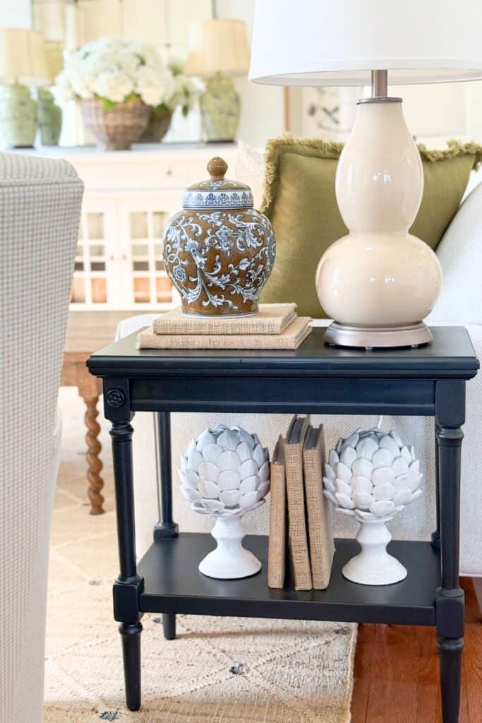 neutral everyday decor styled on a small cabinet for simple after Easter decorating without seasonal pieces